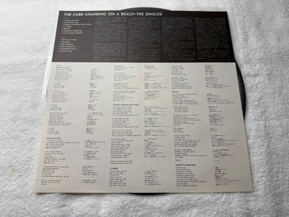 The Cure – Standing On A Beach - The Singles : With Stickers (JP)
