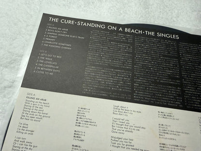 The Cure – Standing On A Beach - The Singles : With Stickers (JP)